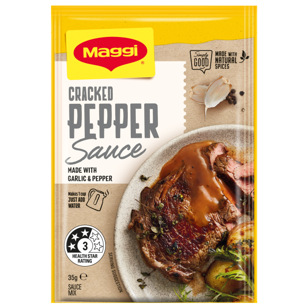 Maggi Cracked Pepper Sauce packet with a steak dish on a white background