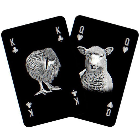 Two playing cards featuring a kiwi bird and a sheep on a white background