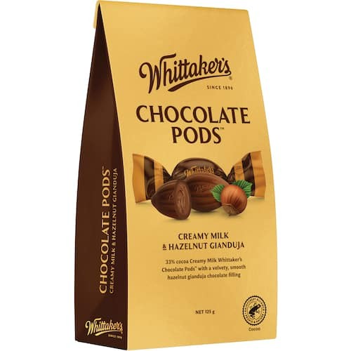 Whittaker’s Cocoa Pods 125g bite-sized New Zealand milk chocolate treats shaped like cocoa pods in brown packaging available in the USA and worldwide