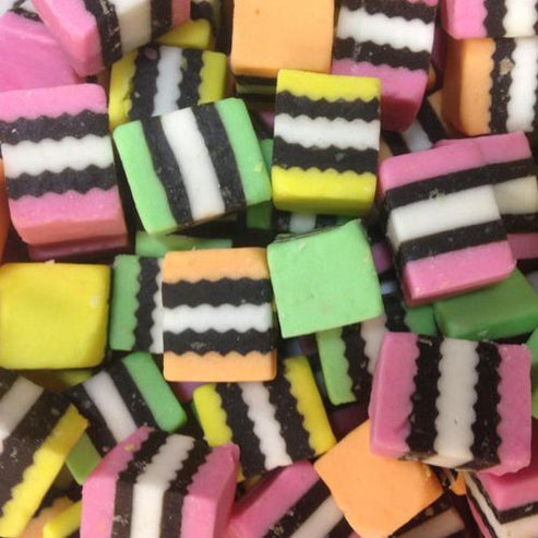 RJs Licorice Allsorts 1kg bulk bag featuring colorful layered coconut and fruit flavored licorice pieces from New Zealand