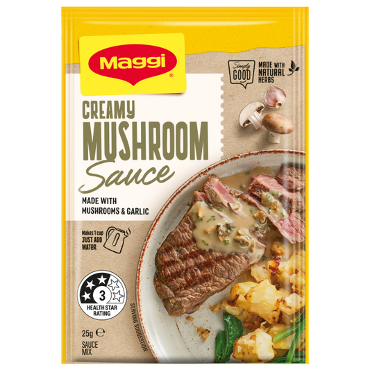 Maggi Creamy Mushroom Sauce packet with a dish of steak and mushrooms on a white background