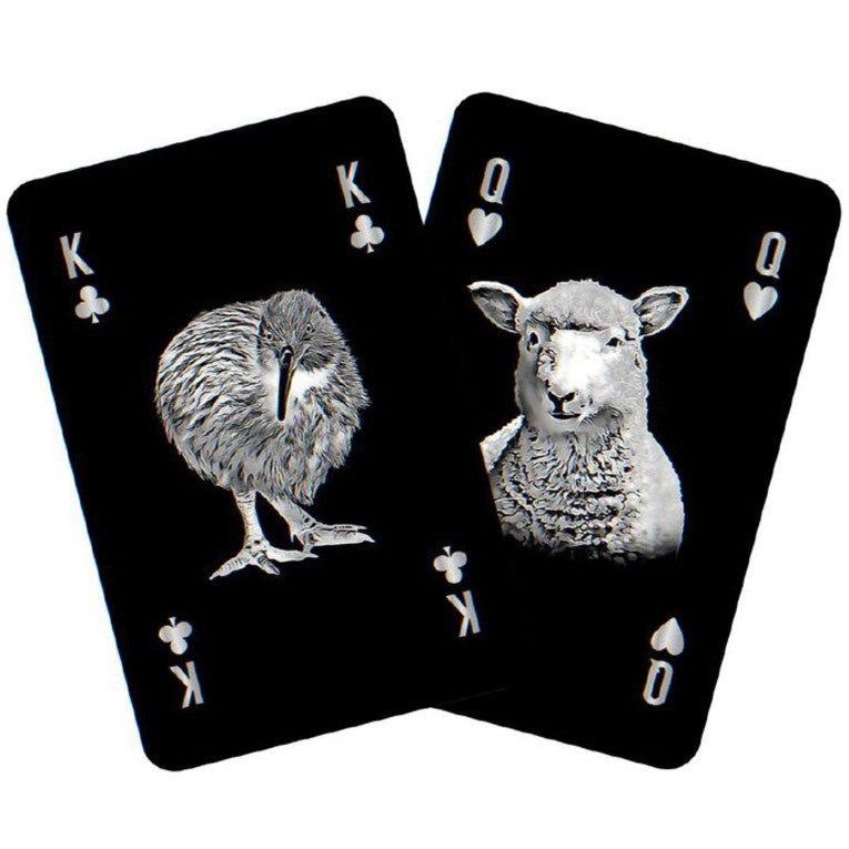 Two playing cards featuring a kiwi bird and a sheep on a white background