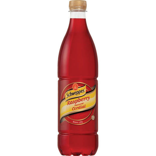 A bottle of Schweppes Raspberry Fizzed Cordial soda, filled with a deep red liquid and topped with a light brown wooden cap, shown against a plain white background.