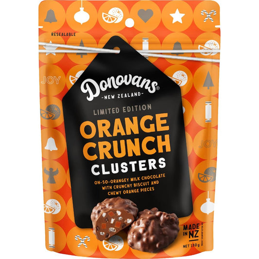 Donovans Clusters Orange Crunch 130g pack featuring orange-flavoured chocolate clusters with chewy orange and crunchy biscuit pieces