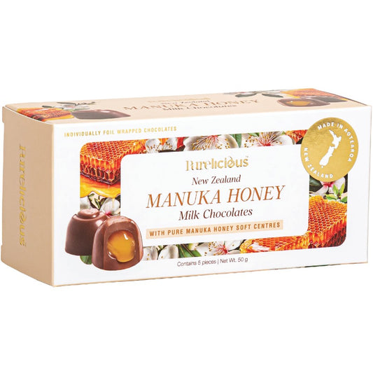 Box of New Zealand Manuka Honey Milk Chocolates with a honeycomb design on the packaging.
